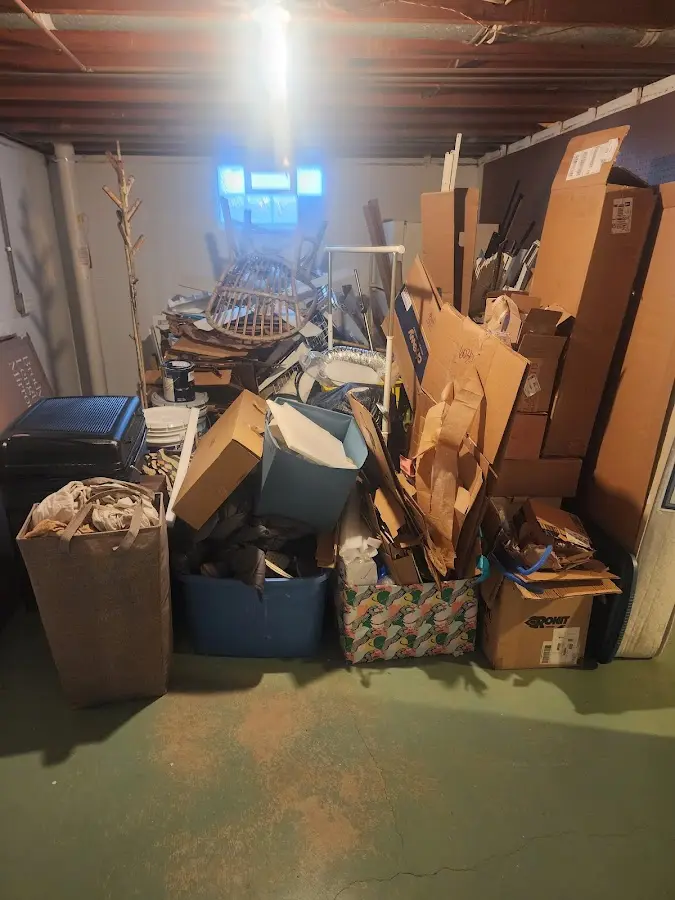 Roll-off dumpster container at job site for 2 Yard Dumpster Rental in Osawatomie